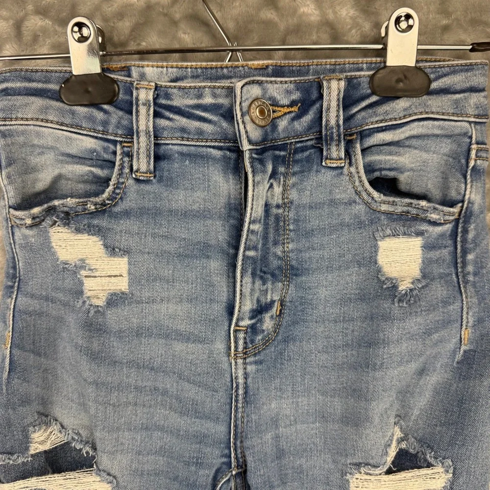 American Eagle Super Hi-Rise Jegging Distressed Blue Jeans Next Level Stretch 0